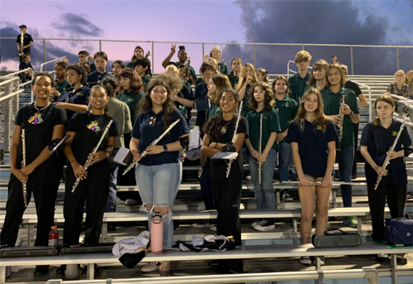 BRMS band members standing on bleachers